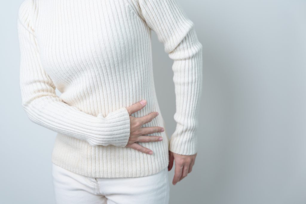 Why Does My Stomach Hurt and Radiate To My Back? AdobeStock 566883676 why does my stomach hurt and radiate to my back? back pain